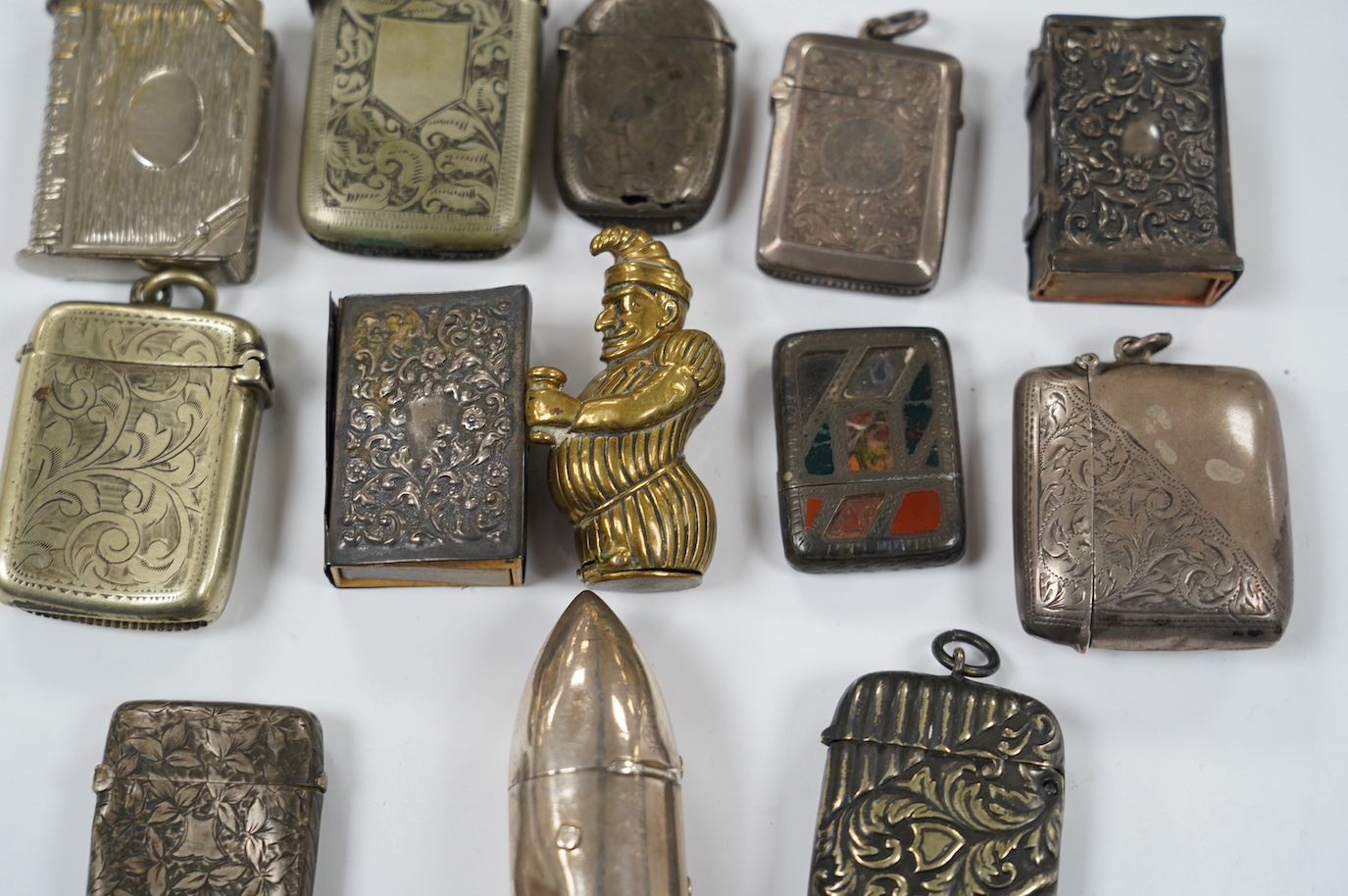 Thirteen silver and novelty vesta cases. Condition - fair